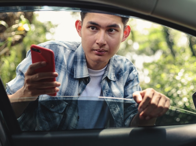 Premium Photo  Asian man waiting for uber taxi