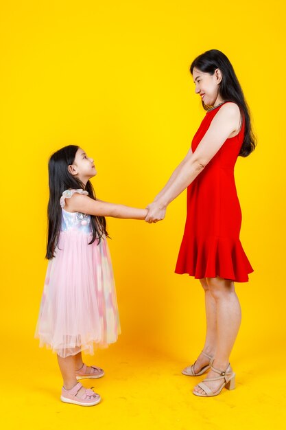 Premium Photo Asian Mom And Daughter Taking Portrait Photo Together