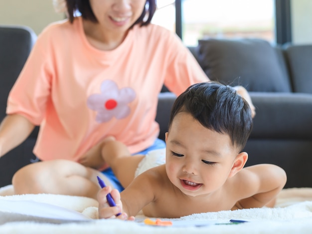 Asian Mom Teaching Her Baby Boy Draw Premium Photo