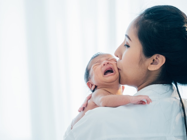 Asian newborn baby with mother Premium Photo