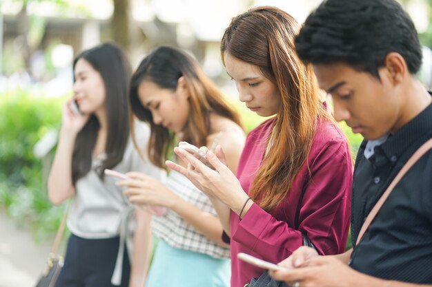 Premium Photo | Asian people play smart phone device for work and play  application with friends