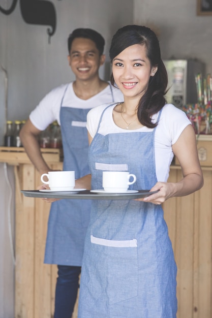 Premium Photo Asian Waitress Serving Coffee