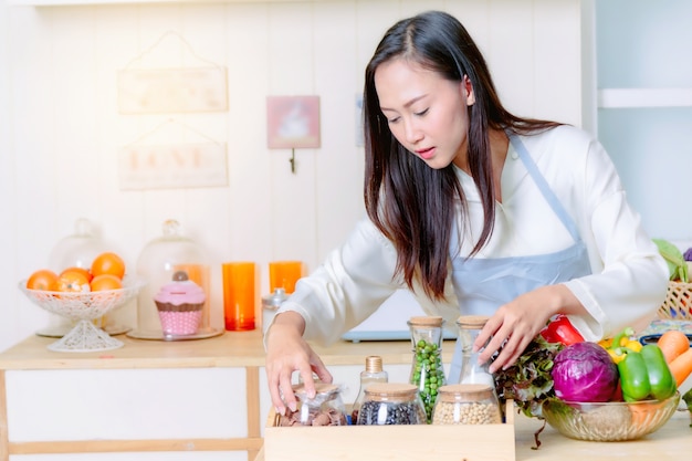 asian woman apron cooking healthy food kitchen 35666 57 - Inilah 7 Pekerjaan Domestik yang Ditetapkan untuk TKI