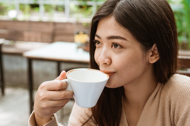 Premium Photo | Asian woman drink in coffee shop