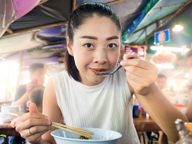 Premium Photo Asian Woman Eating Noodle In Thai Local Restaurant In