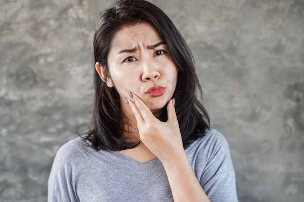 Asian woman having problem with facial palsy Premium Photo