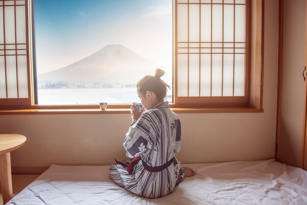 Download Free Asian Woman Is Drinking Green Tea With Fuji Mountain Japan Style Use our free logo maker to create a logo and build your brand. Put your logo on business cards, promotional products, or your website for brand visibility.
