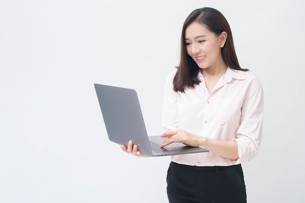 Premium Photo | An asian woman is holding laptop computer on white