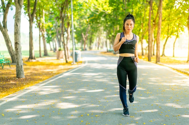 Premium Photo | Asian woman jogging and running