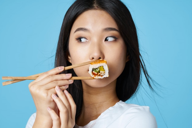 Premium Photo | Asian woman posing with food portrait, sushi