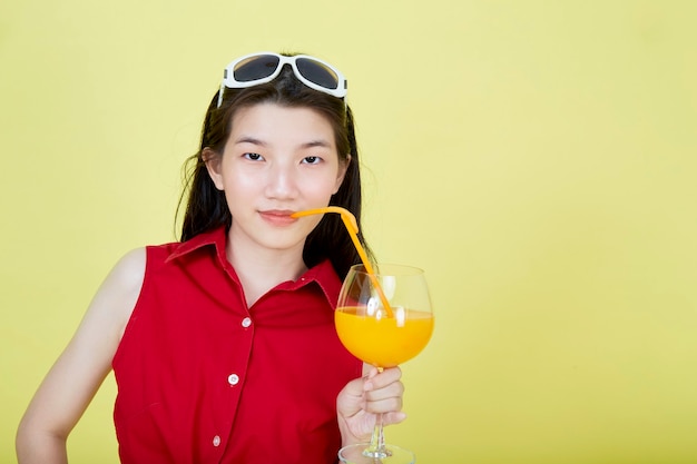 Premium Photo Asian Woman In Summer Casual Clothes With A Glass Of Fresh Fruit Juice