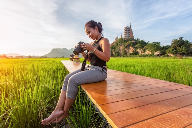 asian-woman-traveler-take-photo-enjoying-wat-tham-suea_35977-1266.jpg