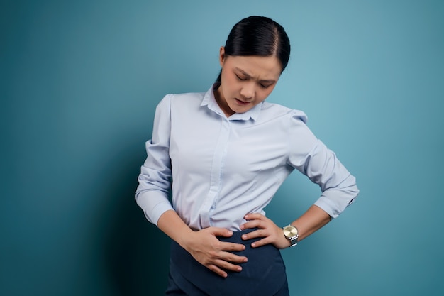 Premium Photo | Asian woman was sick with stomach ache holding hands ...