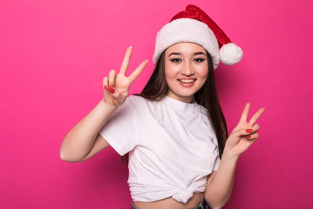 Free Photo Asian Woman Wearing Santas Hat With Peac