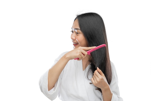 Premium Photo | Asian woman wearing a towel combing beautiful long hair ...