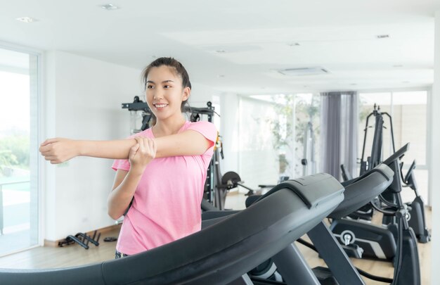 Premium Photo Asian Women Are Exercising In The Gym To Sift Through