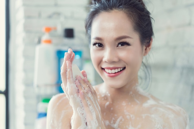 Asian Women Are Taking A Shower In The Bathroom She Is Rubbing Soap She Is Happy And Relaxed
