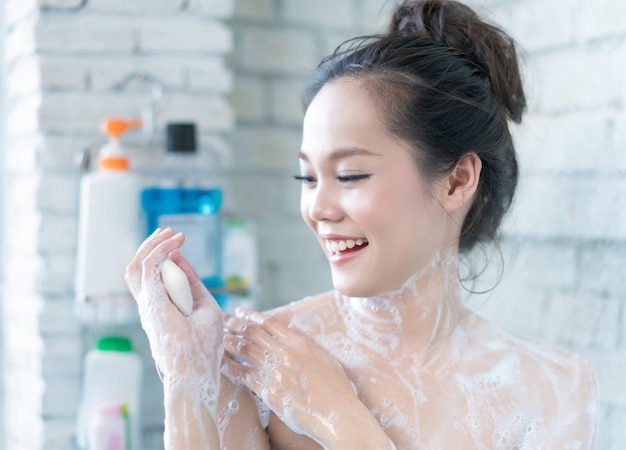 Asian Women Are Taking A Shower In The Bathroom She Is Rubbing Soap She Is Happy And Relaxed