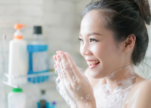 Asian Women Are Taking A Shower In The Bathroom She Is Rubbing Soapshe Is Happy And Relaxed