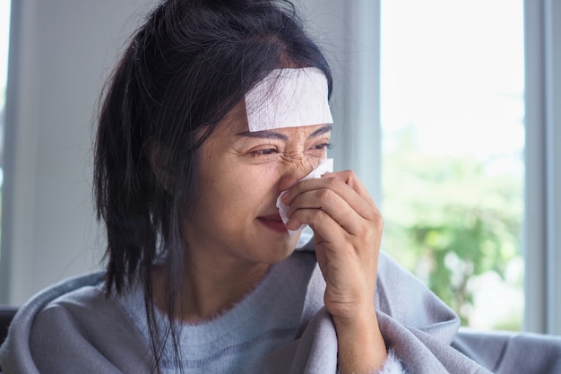 Premium Photo | Asian women have high fever and runny nose. sick people