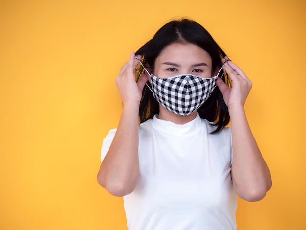 Download Premium Photo Asian Women Wearing Mask Over Yellow Background Yellowimages Mockups