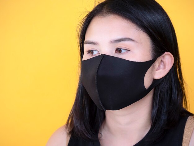 Download Premium Photo Asian Women Wearing Mask Over Yellow Background Yellowimages Mockups