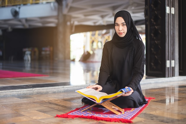 Premium Photo Asian Young Muslim Woman Reading Quran In Mosque In