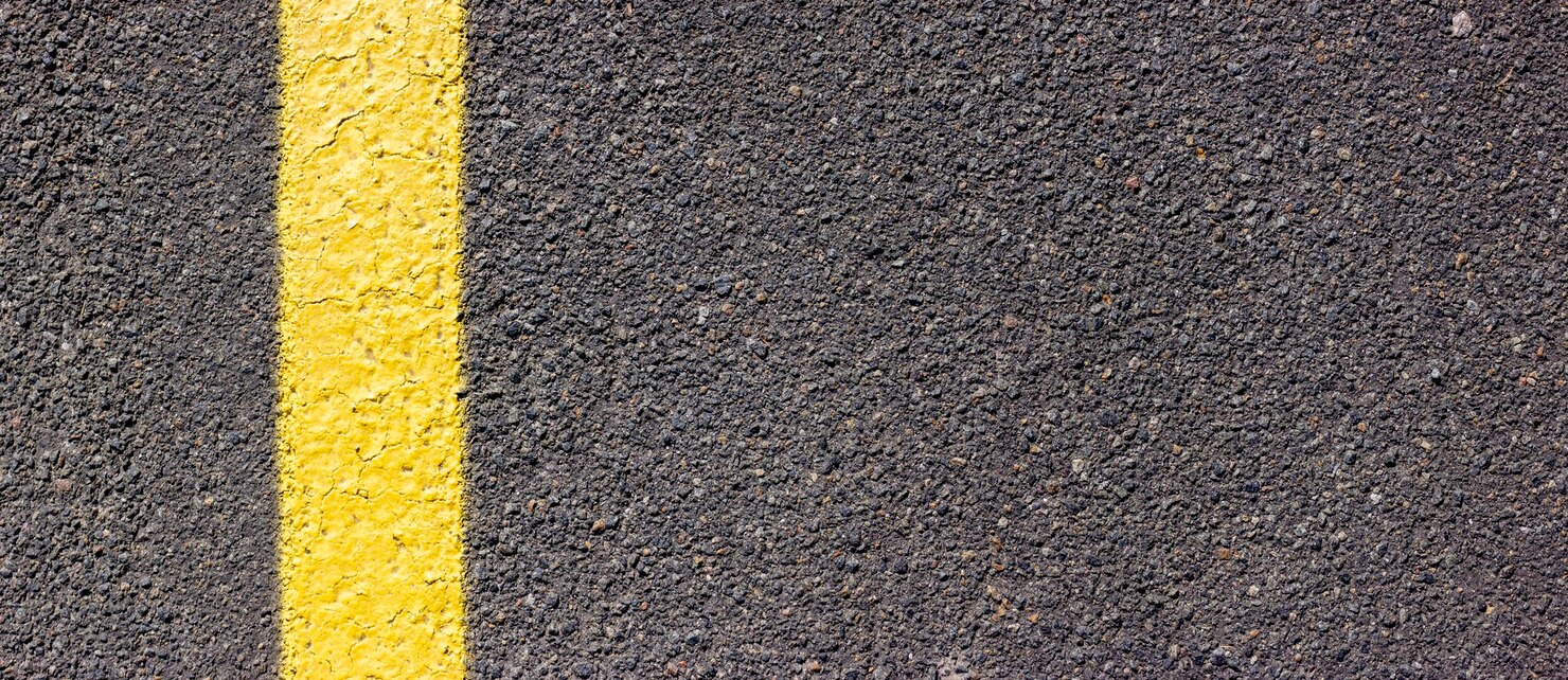 Premium Photo | Asphalt texture with a yellow line on the left side