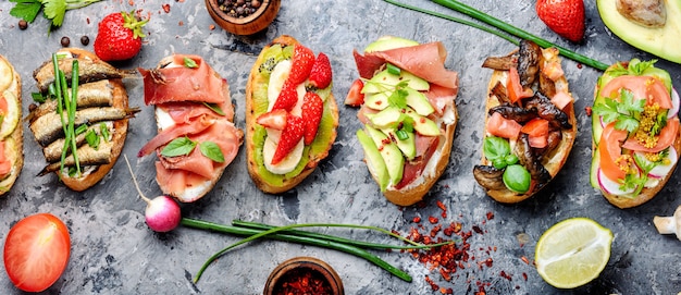 Premium Photo | Assorted bruschetta with various toppings.appetizing ...
