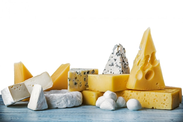 Premium Photo | Assorted cheeses, soft, hard, rennet and brine