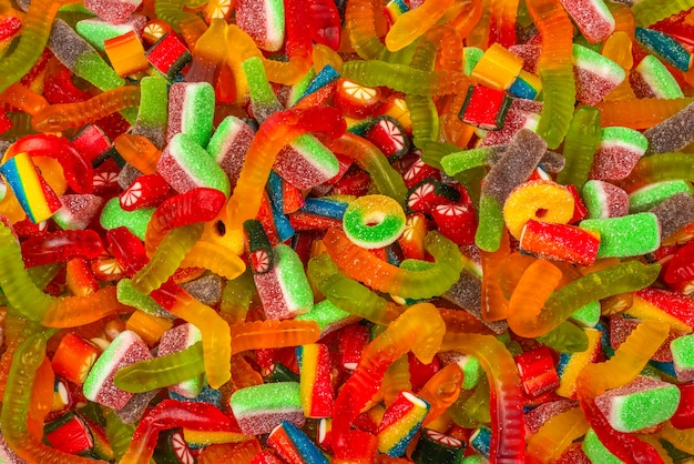 Premium Photo | Assorted gummy candies. top view. jelly sweets background.