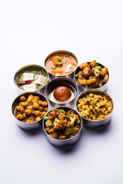 Premium Photo | Assorted indian pakistani food in stainless steel bowls ...