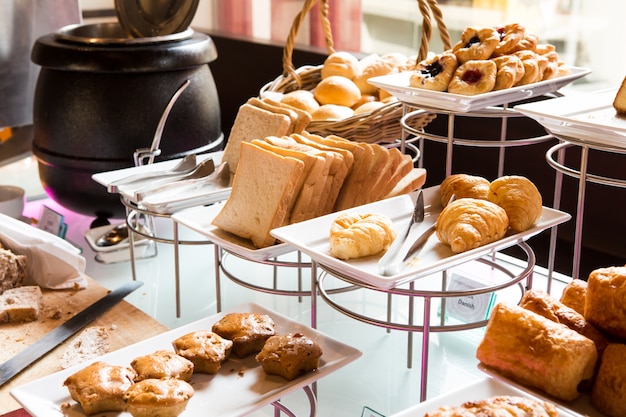 Assortment of fresh pastry on table in buffet Free Photo Assortment of fresh pastry on table in buffet Free Photo