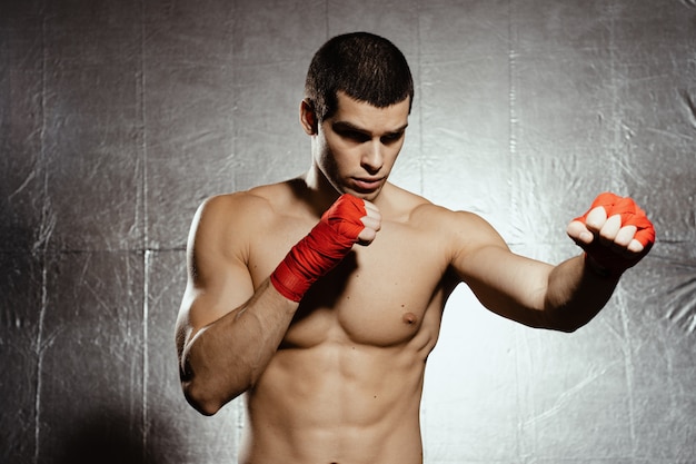 Free Photo | Athletic boxer punching with determination and precaution ...