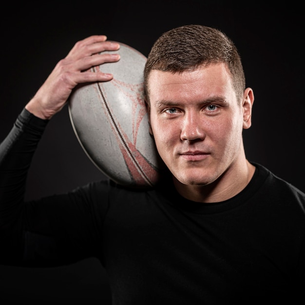 Premium Photo | Athletic Handsome Male Rugby Player Posing With Ball