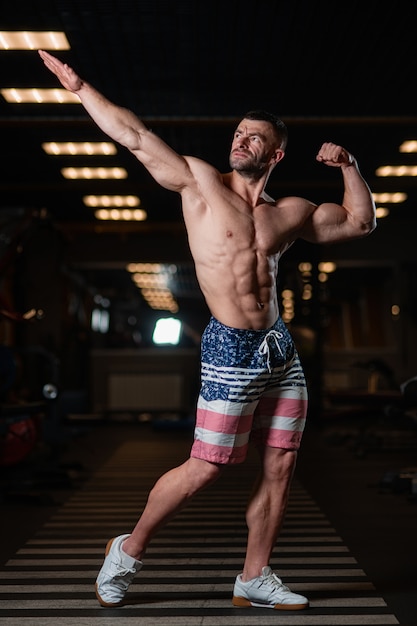 Handsome Muscular Man Flexing Muscles In Gym Stock Image 