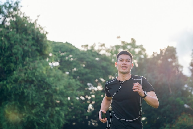 Premium Photo | Athletic young man running in the nature. healthy ...