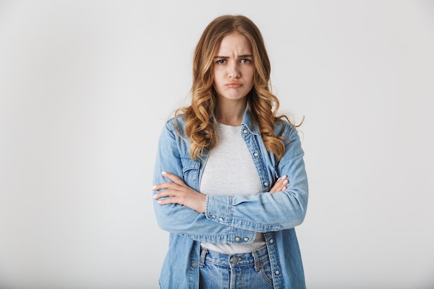 Premium Photo | Attractive angry young girl standing isolated over ...