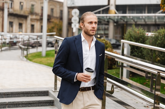 Premium Photo | Attractive confident young blonde haired man in formal ...