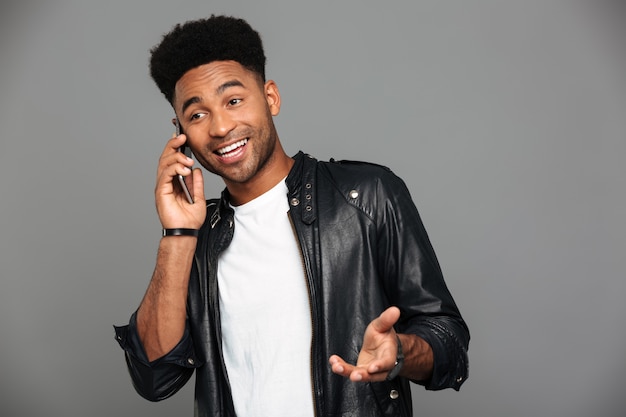 Attractive Happy African Guy With Stylish Haircut Talking On