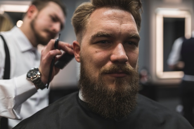 Free Photo | Attractive man having hair cut