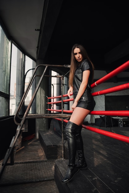 Download Premium Photo Attractive Model Wearing Leather Shorts And Jacket Posing On Boxing Ring