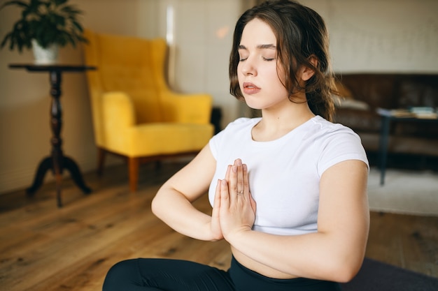 Free Photo | Attractive plus size young woman practicing meditation in ...