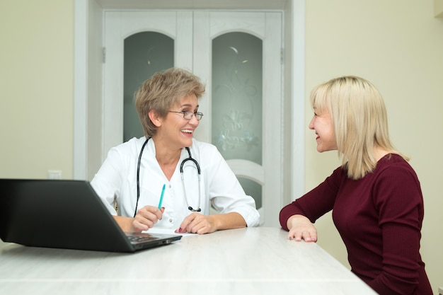 Premium Photo | Attractive woman at the doctor's office in the clinic