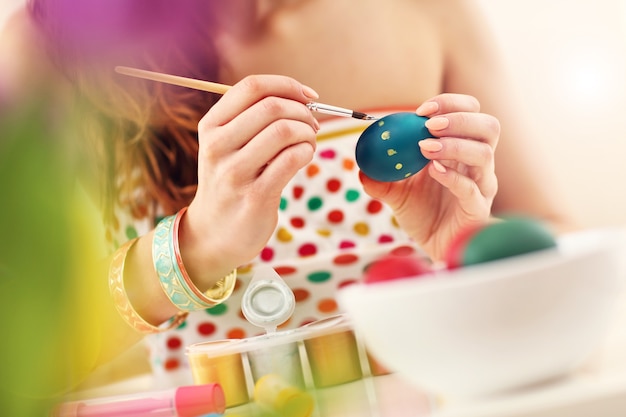 Premium Photo Attractive Woman Painting Easter Eggs At Home