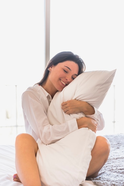 hugging pillow while sleeping