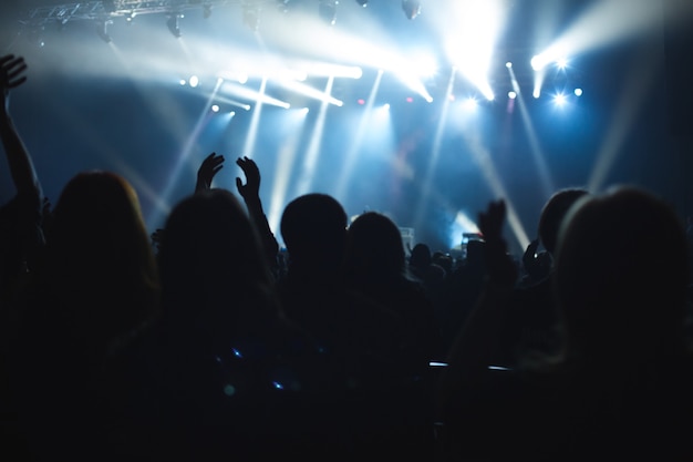 Premium Photo | The audience watching the concert on stage.