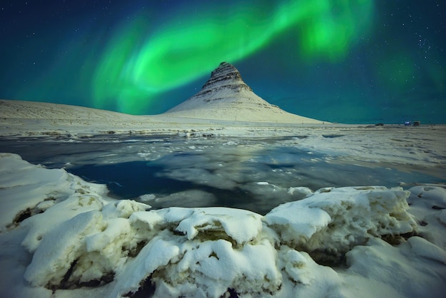 Premium Photo | Aurora light over mount kirkjufell at night in iceland