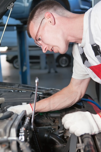 Premium Photo | Auto mechanic repairman at work