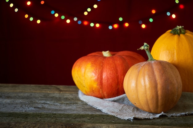 Premium Photo | Autumn background on a dark wooden surface, three